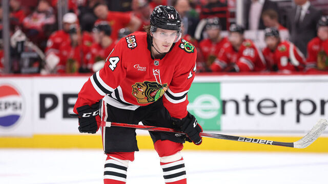 CHICAGO, ILLINOIS - APRIL 09: Kevin Korchinski #14 of the Chicago Blackhawks looks on against the Carolina Hurricanes during the second period at the United Center on April 09, 2026 in Chicago, Illinois.