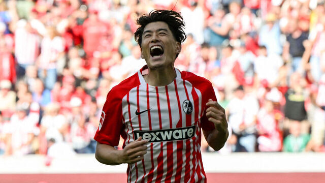 Freiburg's Japanese midfielder #14 Yuito Suzuki celebrates scoring the team's third goal during the German first division Bundesliga football match between SC Freiburg and Werder Bremen in Freiburg, southern Germany, on August 30, 2026. / DFL REGULATIONS PROHIBIT ANY USE OF PHOTOGRAPHS AS IMAGE SEQUENCES AND/OR QUASI-VIDEO