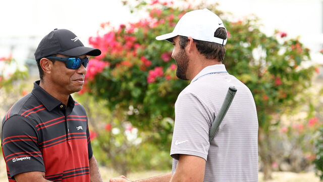 NASSAU, BAHAMAS - DECEMBER 07: Tiger Woods of the United States shakes hands with Scottie Scheffler of the United States on the first tee during the final round of the Hero World Challenge 2025 at Albany Golf Course on December 07, 2025 in Nassau, Bahamas.