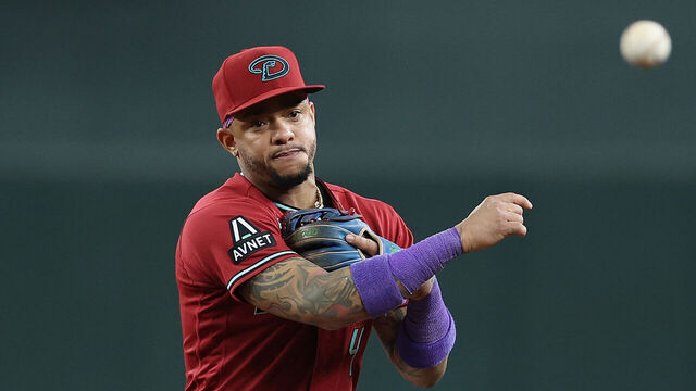 PHOENIX, ARIZONA - AUGUST 11: Ketel Marte #4 of the Arizona Diamondbacks fields a ground-ball out against the Colorado Rockies during the MLB game at Chase Field on August 11, 2026 in Phoenix, Arizona.