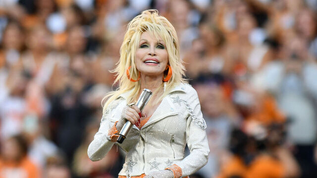 KNOXVILLE, TN - NOVEMBER 18: Dolly Parton performs during the college football game between the Georgia Bulldogs and the Tennessee Volunteers on November 18, 2023, at Neyland Stadium in Knoxville, TN.