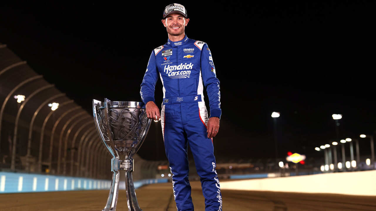 AVONDALE, ARIZONA - NOVEMBER 02: Kyle Larson, driver of the #5 HendrickCars.com Chevrolet, poses for a photo with the Bill France 2025 NASCAR Cup Series Championship trophy after finishing first of the NASCAR Cup Series Championship 4 drivers to win the NASCAR Cup Series Championship at Phoenix Raceway on November 02, 2025 in Avondale, Arizona.