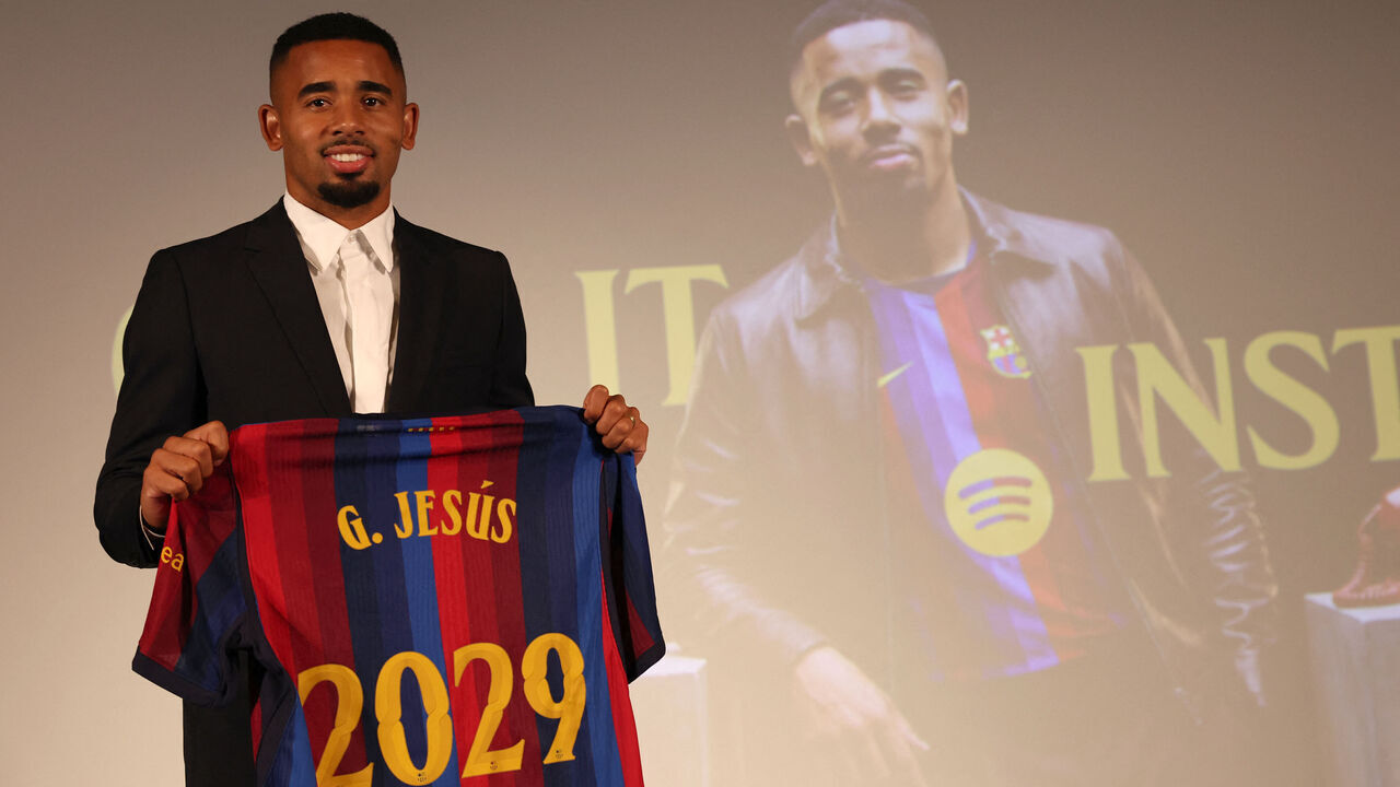 Brazilian forward Gabriel Jesus holds his jersey during his official presentation as FC Barcelona's new player on September 1, 2026 in Barcelona. Barcelona signed Brazilian forward Gabriel Jesus from Arsenal on a deal until 2029.