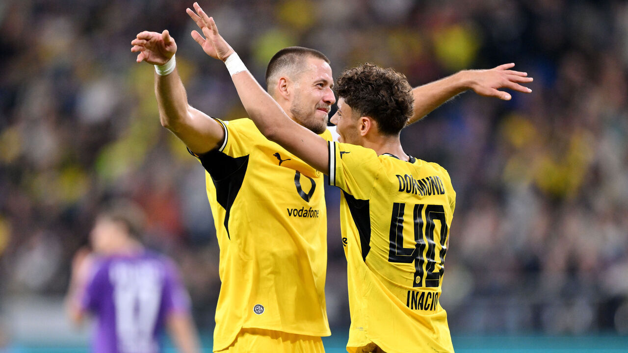 HAMBURG, GERMANY - SEPTEMBER 01: Samuele Inacio of Borussia Dortmund celebrates scoring his team’s third goal with teammate Waldemar Anton during the DFB Cup 2026/27 match between HEBC Hamburg and Borussia Dortmund at Volksparkstadion on September 01, 2026 in Hamburg, Germany.
