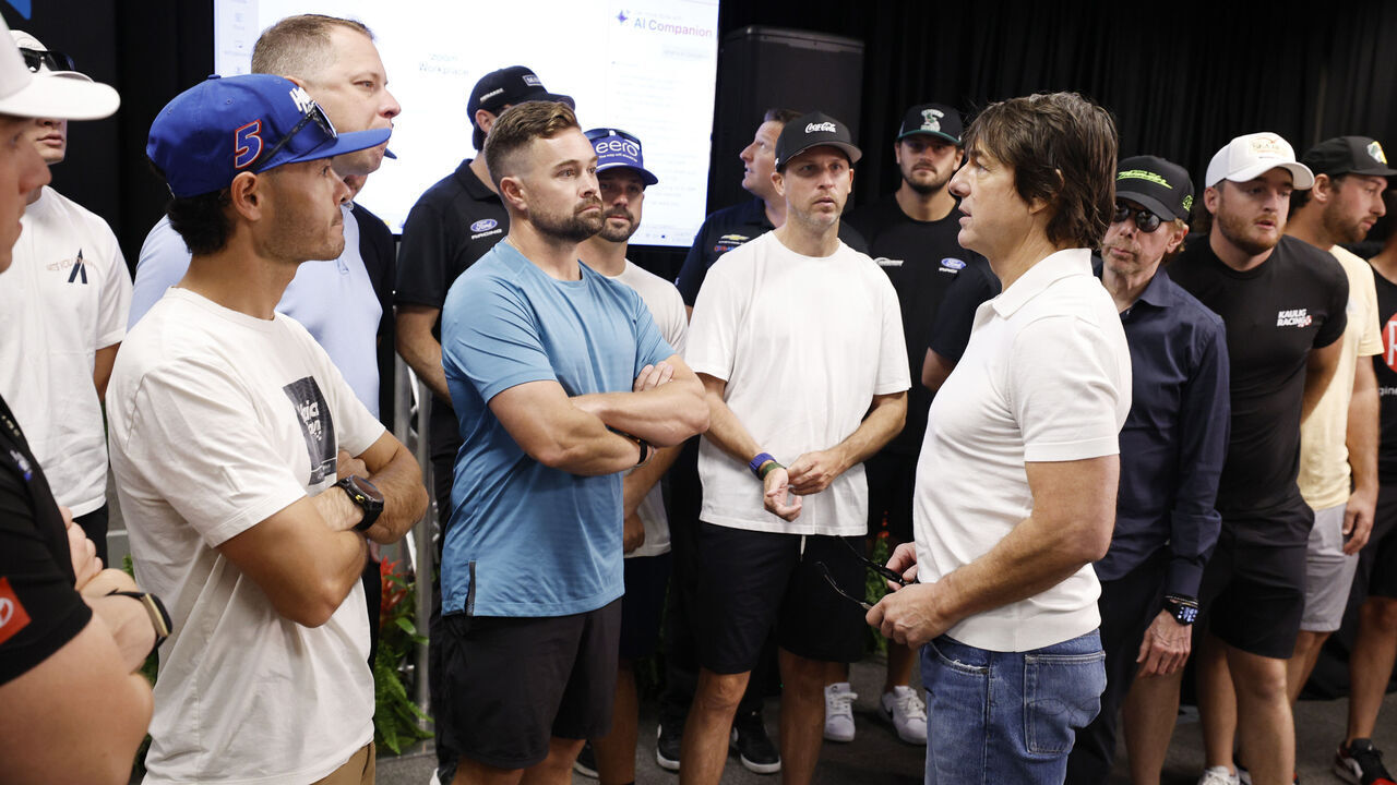 DAYTONA BEACH, FLORIDA - AUGUST 29: Tom Cruise speaks to guests at the NASCAR COKE ZERO SUGAR 400 at Daytona International Speedway on August 29, 2026, in preperation for Days of Thunder.