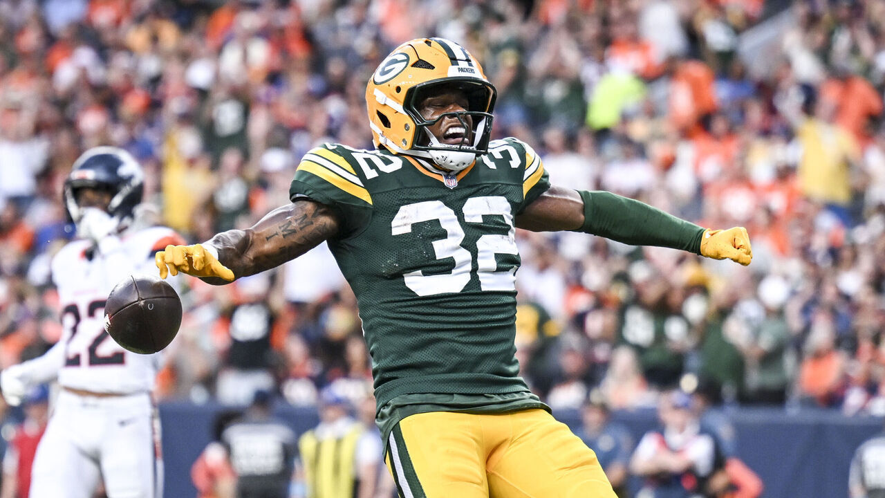 DENVER , CO - AUGUST 21: Marshawn Lloyd (32) of the Green Bay Packers celebrates scoring a receiving touchdown against the Denver Broncos during the first quarter at Empower Field at Mile High in Denver, Colorado on Friday, August 21, 2026.