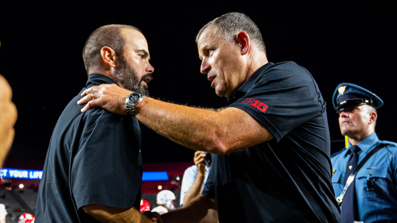 Joe Harasymiak, head coach of the UMass Minutemen, and Greg Shiano, head coach of the Rutgers Scarlet Knights, shake hands after an NCAA FBS football game at SHI Stadium in Piscataway, United States, on September 3, 2026.