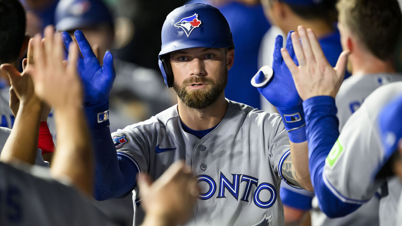KANSAS CITY, MISSOURI - SEPTEMBER 4: Nathan Lukes of the Toronto Blue Jays is congratulated after scoring against the Kansas City Royals during the sixth inning at Kauffman Stadium on September 4, 2026 in Kansas City, Missouri.