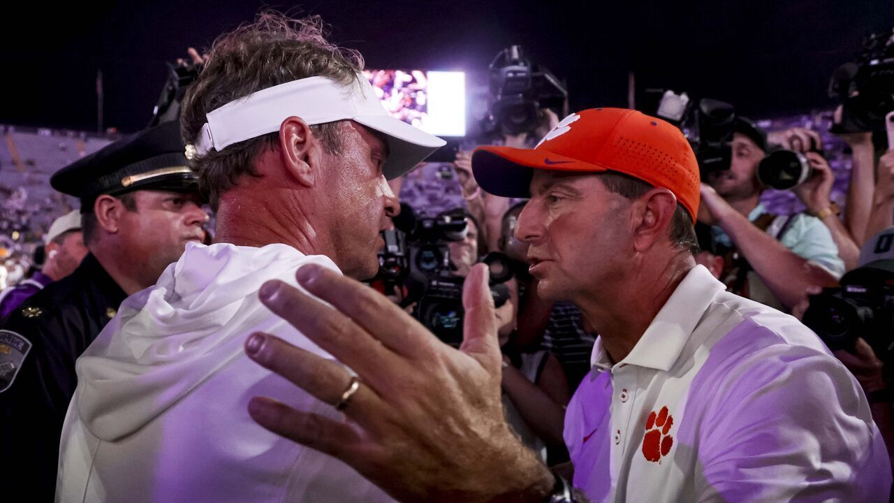 BATON ROUGE, LA - SEPTEMBER 05: LSU Tigers head coach Lane Kiffin and Clemson Tigers head coach Dabo Swinney meet at midfield following a game at Tiger Stadium on September 5, 2026 in Baton Rouge, Louisiana.