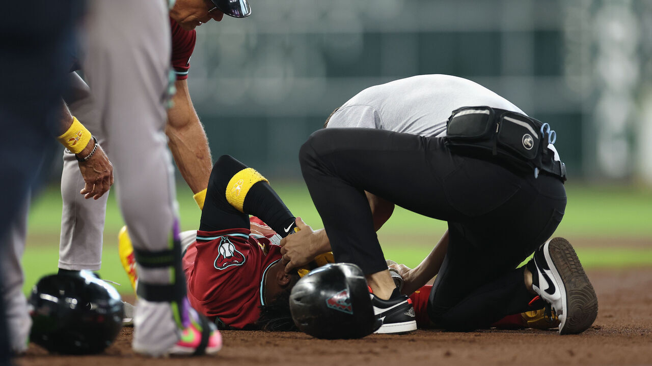 HOUSTON, TEXAS - SEPTEMBER 06: Geraldo Perdomo #2 of the Arizona Diamondbacks is tended to by medical staff in the third inning of the game against the Houston Astros at Daikin Park on September 06, 2026 in Houston, Texas.