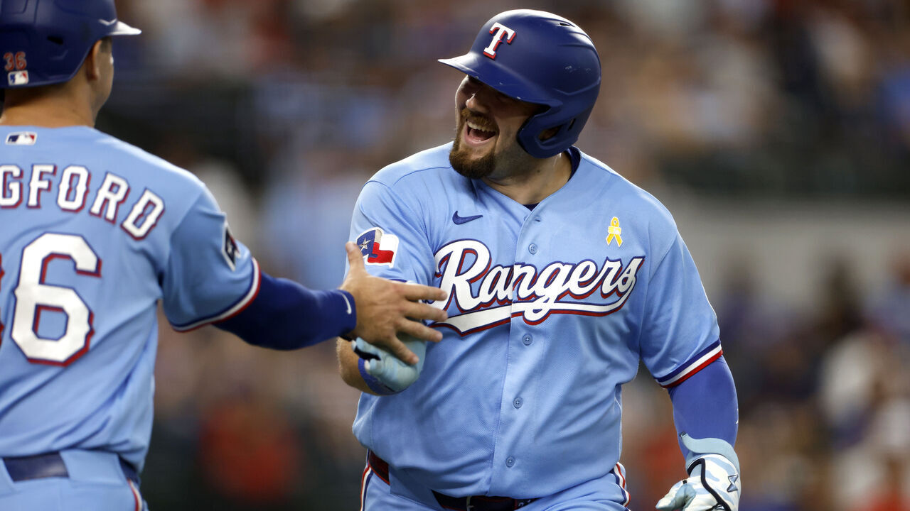 ARLINGTON, TEXAS - SEPTEMBER 6: Jake Burger #21 of the Texas Rangers celebrates after hitting a two-run home run against the Tampa Bay Rays during the fourth inning at Globe Life Field on September 6, 2026 in Arlington, Texas.