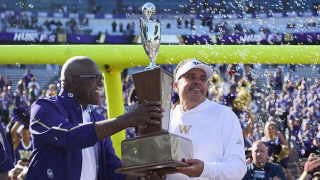 SEATTLE, WASHINGTON - SEPTEMBER 06: Jedd Fisch of the Washington Huskies lifts the Apple Cup trophy after then game against the Washington State Cougars at Husky Stadium on September 6, 2026 in Seattle, Washington.