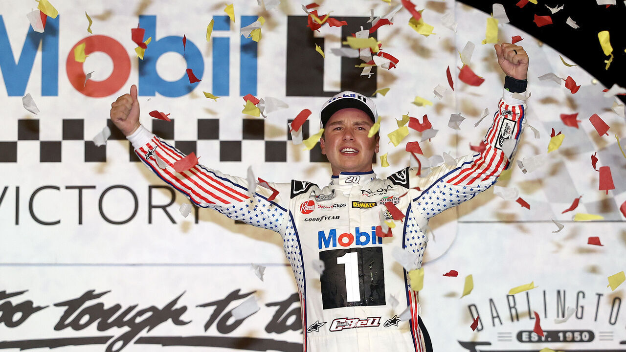 DARLINGTON, SOUTH CAROLINA - SEPTEMBER 06: Christopher Bell, driver of the #20 Mobil 1 Toyota, celebrates in victory lane after winning the NASCAR Cup Series Cook Out Southern 500 at Darlington Raceway on September 06, 2026 in Darlington, South Carolina.