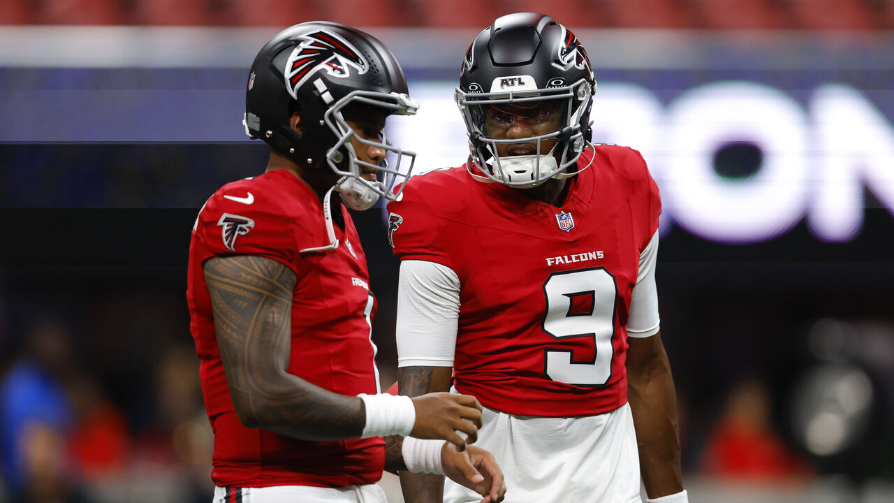 ATLANTA, GEORGIA - AUGUST 14: Tua Tagovailoa #1 of the Atlanta Falcons warms up with Michael Penix Jr. #9 prior to the NFL preseason game against the Denver Broncos at Mercedes-Benz Stadium on August 14, 2026 in Atlanta, Georgia.