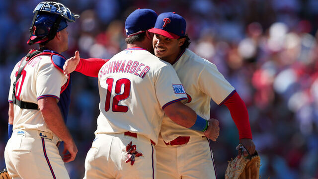 PHILADELPHIA, PENNSYLVANIA - SEPTEMBER 7: Jesus Luzardo #44 of the Philadelphia Phillies celebrates with J.T. Realmuto #10 (left) and Kyle Schwarber #12 (right) after pitching a complete game for the win against the Atlanta Braves at Citizens Bank Park on September 7, 2026 in Philadelphia, Pennsylvania.