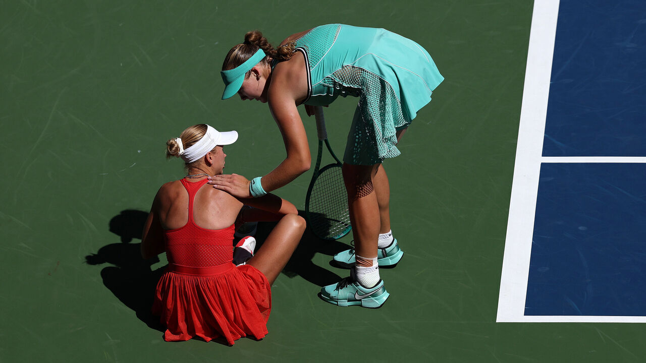 NEW YORK, NEW YORK - SEPTEMBER 07: (L-R) Anastasia Potapova of Austria is helped by Mirra Andreeva after an injury during their Women's Singles Fourth Round match on Day Nine of the 2026 US Open at USTA Billie Jean King National Tennis Center on September 07, 2026 in the Flushing neighborhood of the Queens borough of New York City.