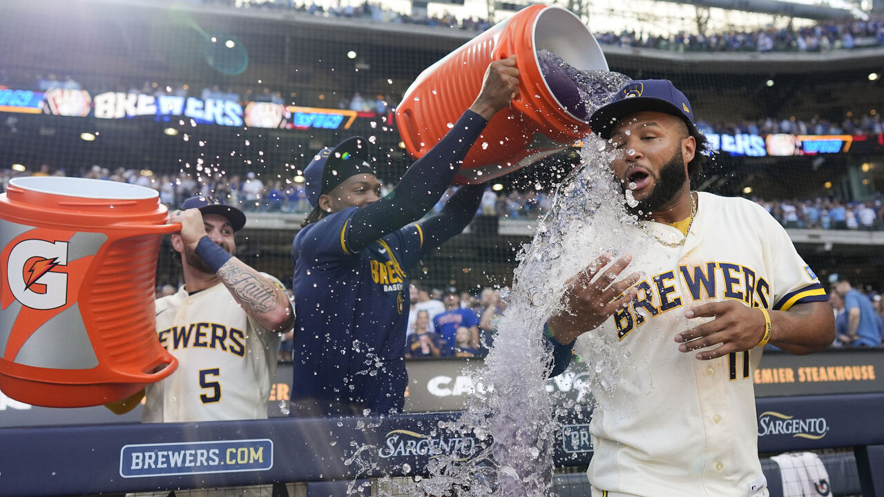MILWAUKEE, WISCONSIN - SEPTEMBER 07: Jackson Chourio #11 of the Milwaukee Brewers is dunked by Abner Uribe #45 and Garrett Mitchell #5 of the Milwaukee Brewers after a game against the Chicago Cubs at American Family Field on September 07, 2026 in Milwaukee, Wisconsin.