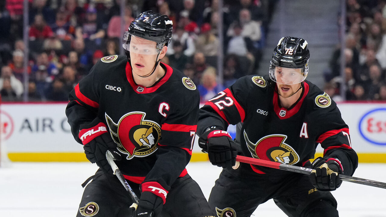 OTTAWA, CANADA - MARCH 19: Brady Tkachuk #7 of the Ottawa Senators controls the puck against the New York Islanders as he enters the zone, with teammate Thomas Chabot #72 during the third period on March 19, 2026 at Canadian Tire Centre in Ottawa, Ontario, Canada.
