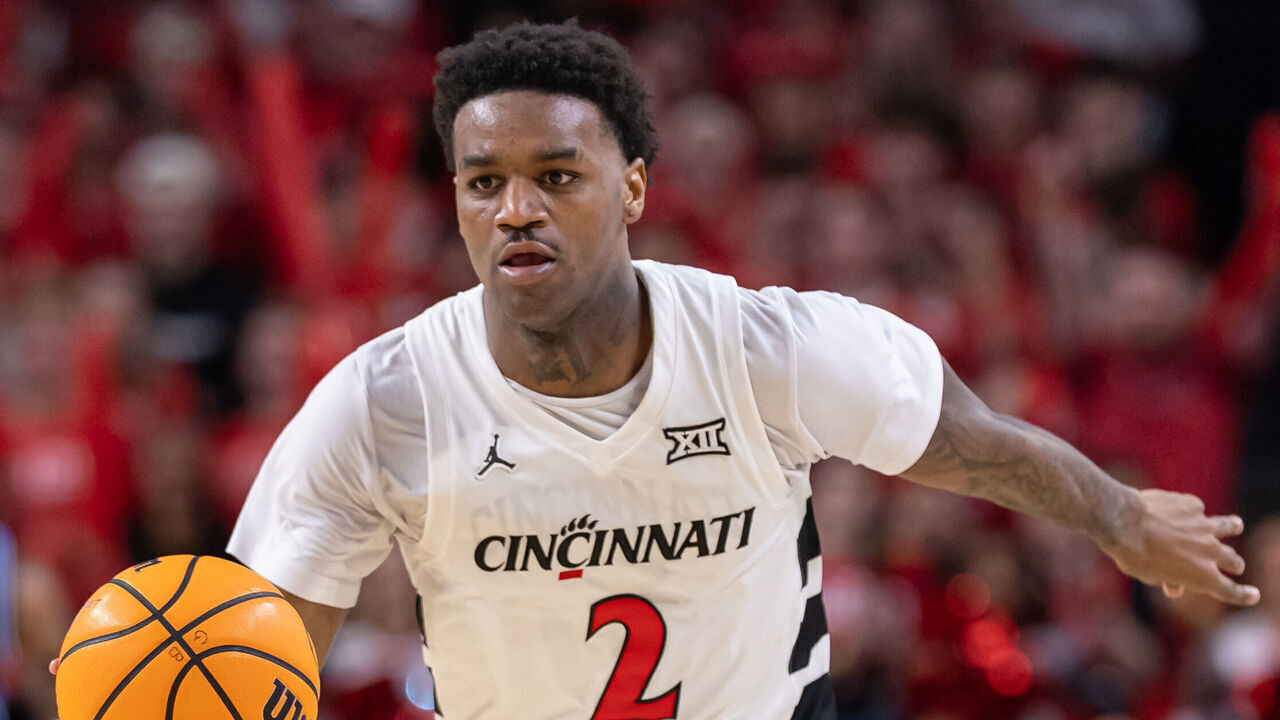 CINCINNATI, OHIO - MARCH 3: Jizzle James #2 of the Cincinnati Bearcats brings the ball up court during the game against the BYU Cougars at Fifth Third Arena on March 3, 2026 in Cincinnati, Ohio.