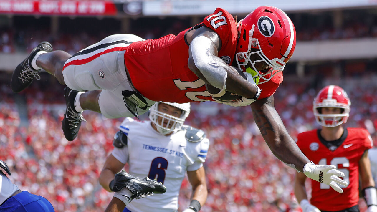 ATHENS, GEORGIA - SEPTEMBER 5: Elyiss Williams #10 of the Georgia Bulldogs goes airborne for a touchdown during the first quarter against the Tennessee State Tigers at Sanford Stadium on September 5, 2026 in Athens, Georgia.