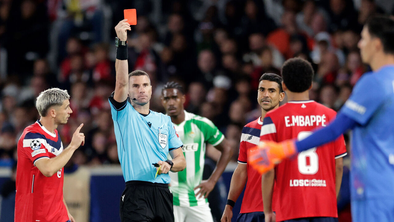 LILLE, FRANCE - SEPTEMBER 8: Referee Georgi Kabakov gives a red card to Ethan Mbappe of Lille during the UEFA Champions League match between Lille v Real Betis at the Stade Pierre Mauroy on September 8, 2026 in Lille France