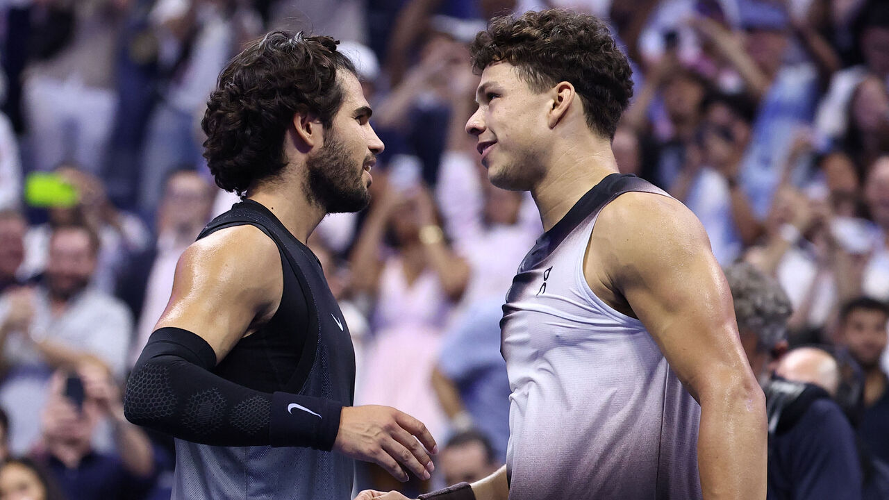USA's Ben Shelton (R) shakes hands with Spain's Carlos Alcaraz after winning the men's singles quarter-final tennis match on day ten of the US Open tennis tournament at the USTA Billie Jean King National Tennis Center in New York City on September 9, 2026.
