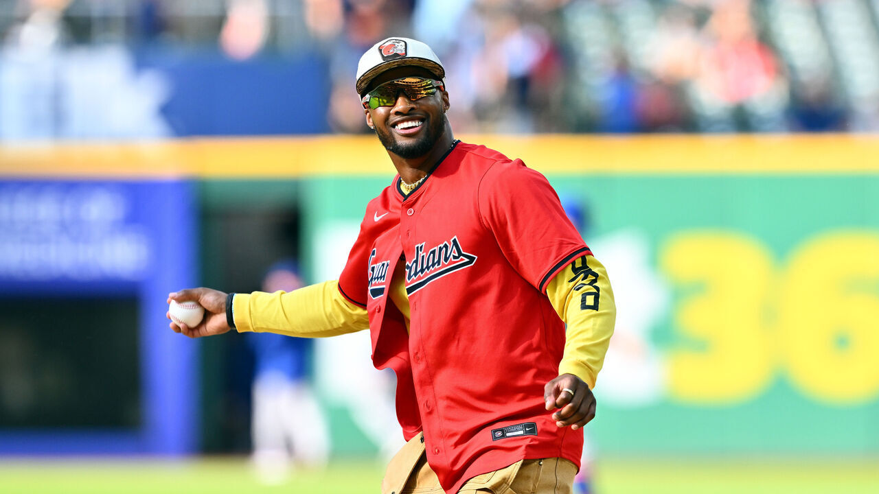 CLEVELAND, OHIO - MAY 21: Denzel Ward of the Cleveland Browns throws out a ceremonial first pitch prior to the game between the Cleveland Guardians and the New York Mets at Progressive Field on May 21, 2024 in Cleveland, Ohio.
