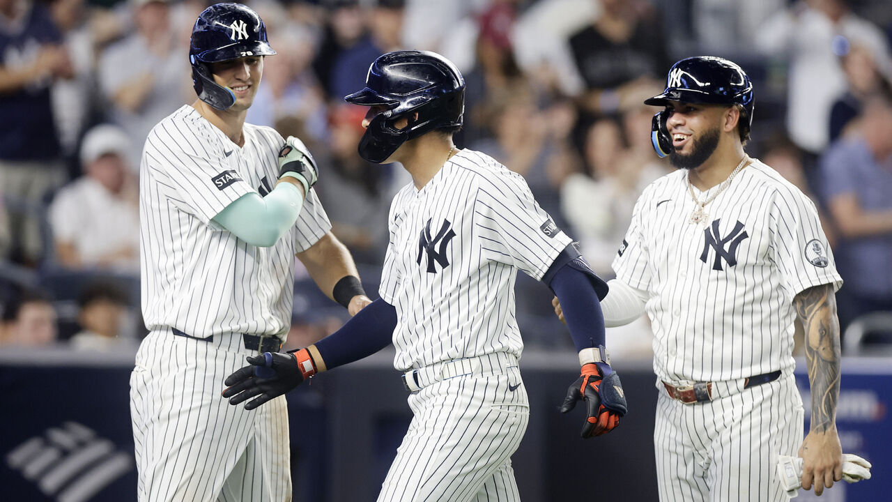 NEW YORK, NEW YORK - SEPTEMBER 09: George Lombard Jr. #96 of the New York Yankees celebrates with teammates Spencer Jones #78 (L) and Luis Garcia Jr. #26 (R) after hitting a grand slam against the Colorado Rockies in the third inning at Yankee Stadium on September 09, 2026 in New York City.