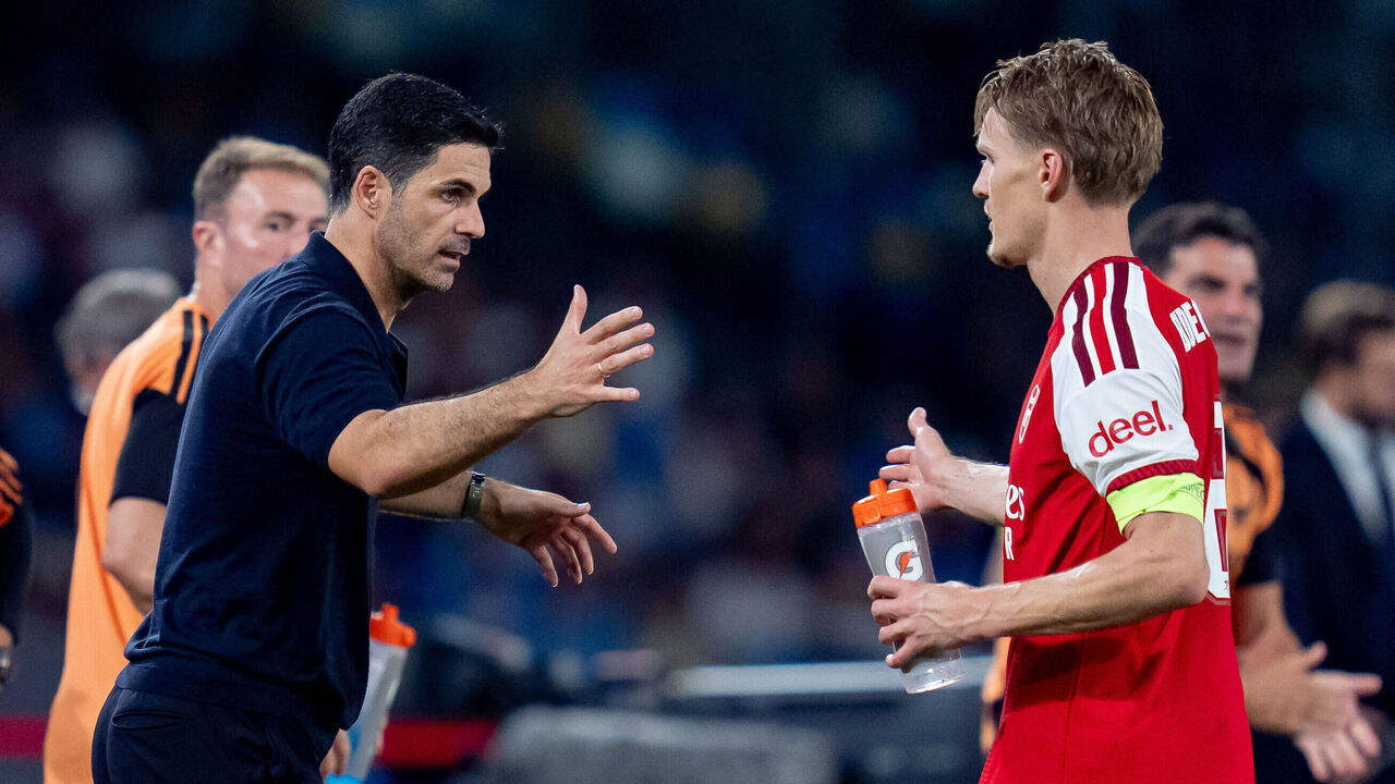 Martin Odegaard of Arsenal FC celebrates with Mikel Arteta after scoring first goal during the UEFA Champions League 2026/27 League Phase MD1 match between SSC Napoli and Arsenal FC at Diego Armando Maradona Stadium on September 09, 2026 in Naples, Italy