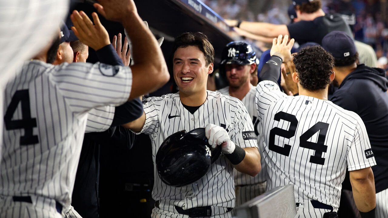 NEW YORK, NY - SEPTEMBER 10: Anthony Volpe #11 of the New York Yankees high fives teammates after hitting a grand slam during the game against the Colorado Rockies at Yankee Stadium on September 10, 2026 in New York, New York.