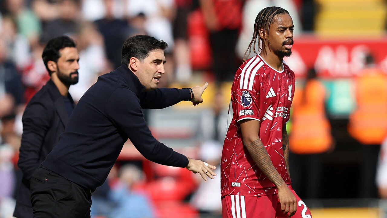 LIVERPOOL, ENGLAND - SEPTEMBER 12: Andoni Iraola, Manager of Liverpool, speaks to Bradley Barcola during the Premier League 2026/27 match between Liverpool FC and Fulham at Anfield on September 12, 2026 in Liverpool, England.