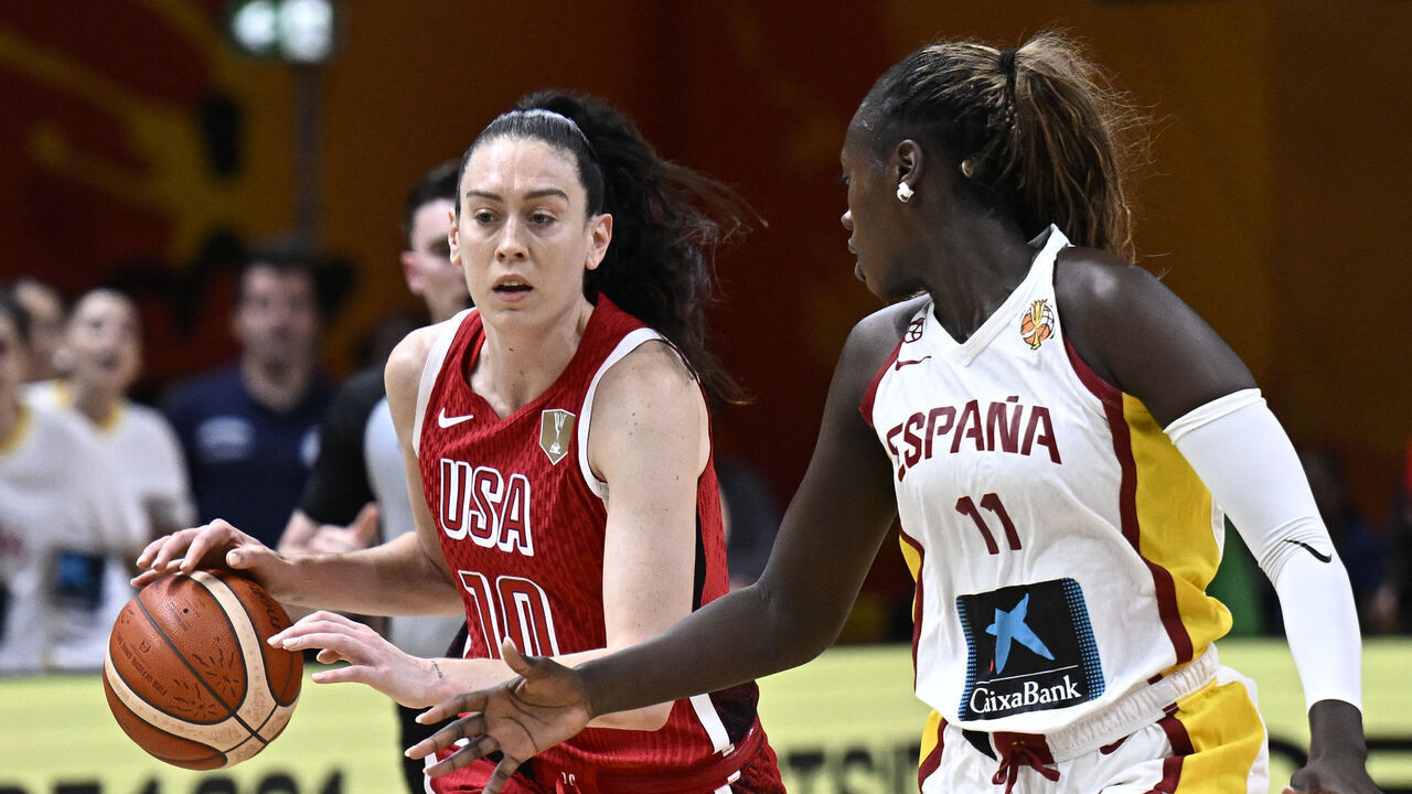 USA's power forward #10 Breanna Stewart and Spain's center #11 Awa Fam vie for the ball during the 2026 FIBA Women's Basketball World Cup semi-final match between Spain and the United States in Berlin on September 12, 2026.