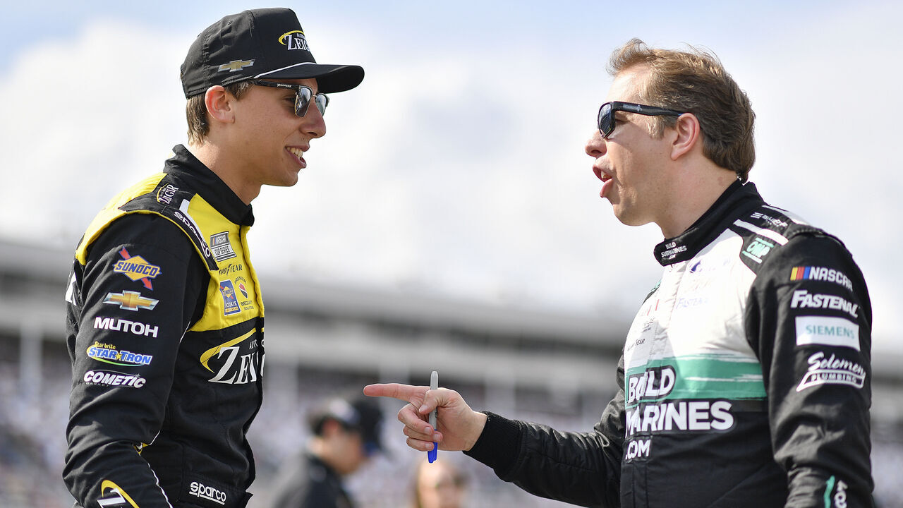 CONCORD, NORTH CAROLINA - MAY 25: Brad Keselowski, driver of the #6 BuildSubmarines.com Ford, (R) and Carson Hocevar, driver of the #77 Zeigler Auto Group Chevrolet, talk on the grid during practice for the NASCAR Cup Series Coca-Cola 600 at Charlotte Motor Speedway on May 25, 2024 in Concord, North Carolina.
