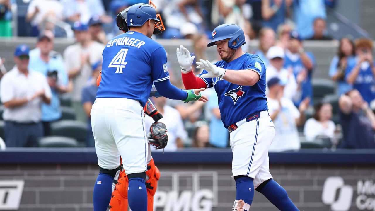 TORONTO, ON - SEPTEMBER 12: Alejandro Kirk #30 of the Toronto Blue Jays celebrates with George Springer #4 after hitting a 2-run home run in the third inning during a game against the Baltimore Orioles at Rogers Centre on September 12, 2026 in Toronto, Ontario, Canada.