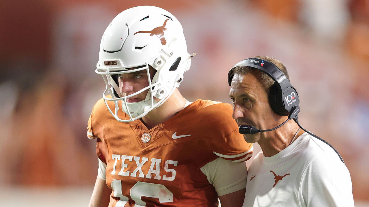 AUSTIN, TEXAS - SEPTEMBER 12: Head coach Steve Sarkisian of the Texas Longhorns speaks with Arch Manning #16 of the Texas Longhorns during the fourth quarter against the Ohio State Buckeyes at Darrell K Royal-Texas Memorial Stadium on September 12, 2026 in Austin, Texas.