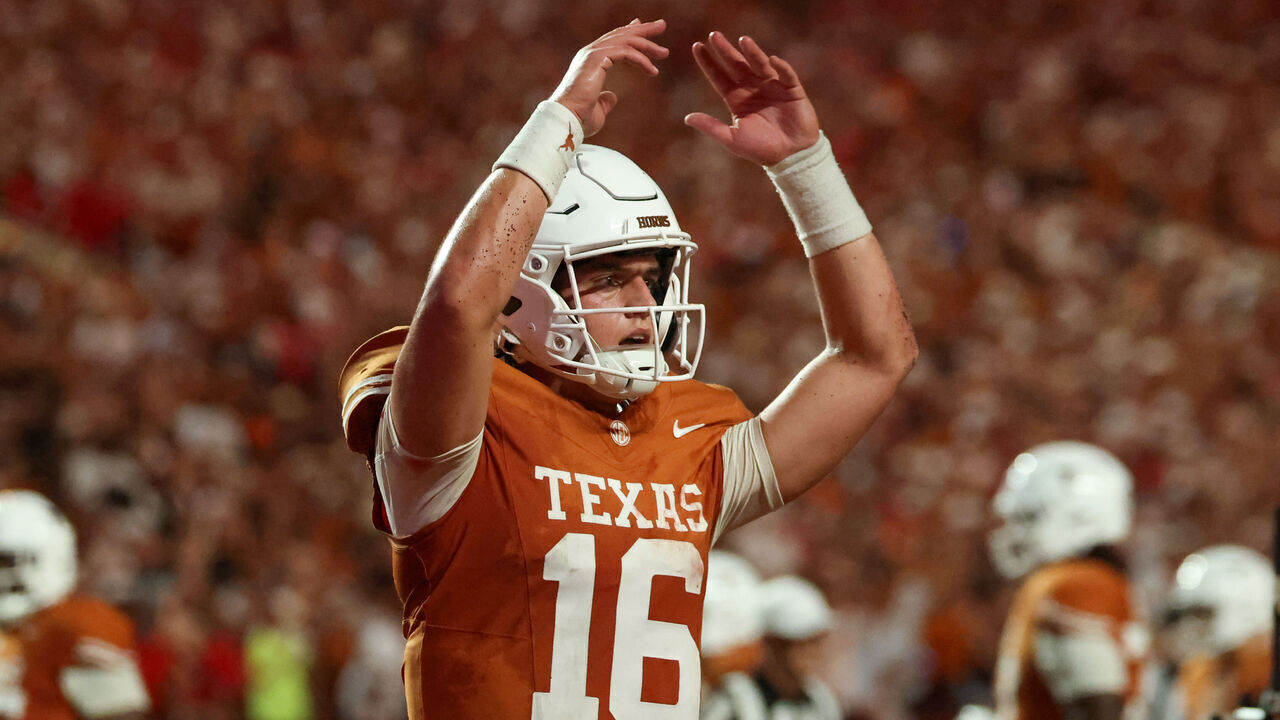 AUSTIN, TX - SEPTEMBER 12: Quarterback Arch Manning #16 of the Texas Longhorns raises his arms to get the crowd going after scoring another touchdown late in the college football game the Texas Longhorns and the Ohio State Buckeyes on September 12, 2026, at Darrell K Royal-Texas Memorial Stadium in Austin, TX.