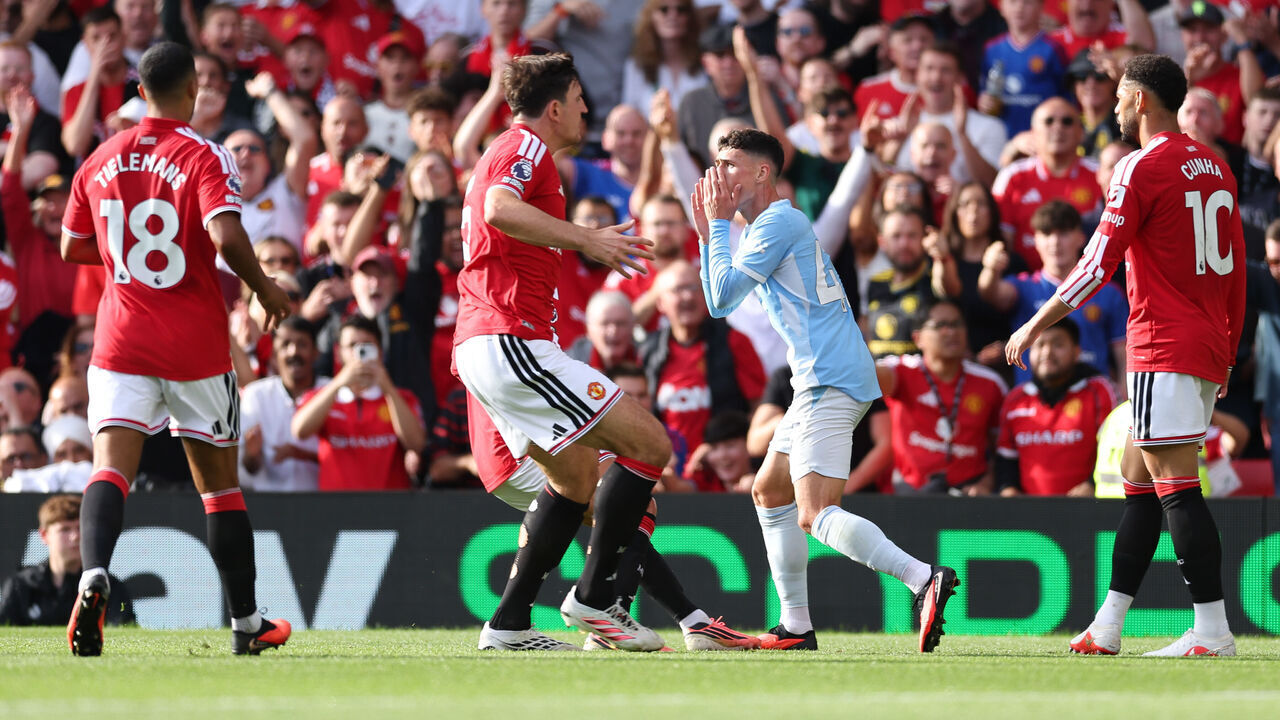 MANCHESTER, ENGLAND - SEPTEMBER 13: Phil Foden of Manchester City reacts as he is shown a red card by Referee Michael Oliver during the Premier League 2026/27 match between Manchester United and Manchester City at Old Trafford on September 13, 2026 in Manchester, England.