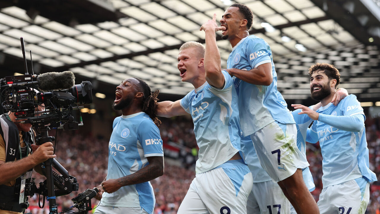 MANCHESTER, ENGLAND - SEPTEMBER 13: Erling Braut Haaland of Manchester City celebrates with teammates after scoring their side's first goal following a VAR review during the Premier League 2026/27 match between Manchester United and Manchester City at Old Trafford on September 13, 2026 in Manchester, England.