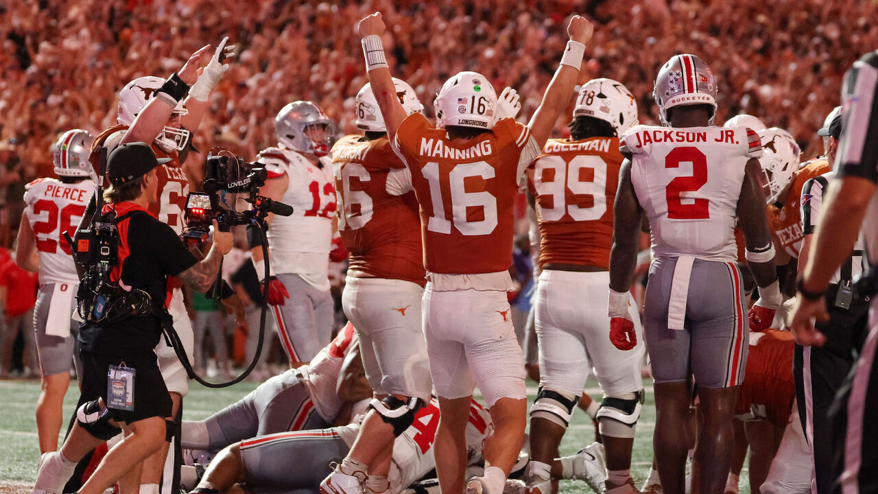 AUSTIN, TX - SEPTEMBER 12: Quarterback Arch Manning #16 of the Texas Longhorns holds up his arms to celebrate the game tying touchdown late in the college football game the Texas Longhorns and the Ohio State Buckeyes on September 12, 2026, at Darrell K Royal-Texas Memorial Stadium in Austin, TX.