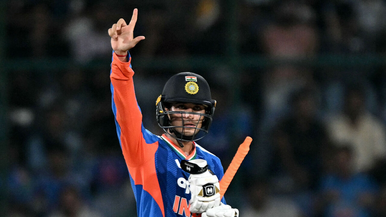 India's Abhishek Sharma celebrates after scoring a half-century (50 runs) during the first T20 international cricket match between India and Afghanistan at the Arun Jaitley Stadium in New Delhi on September 13, 2026. / -- IMAGE RESTRICTED TO EDITORIAL USE - STRICTLY NO COMMERCIAL USE --