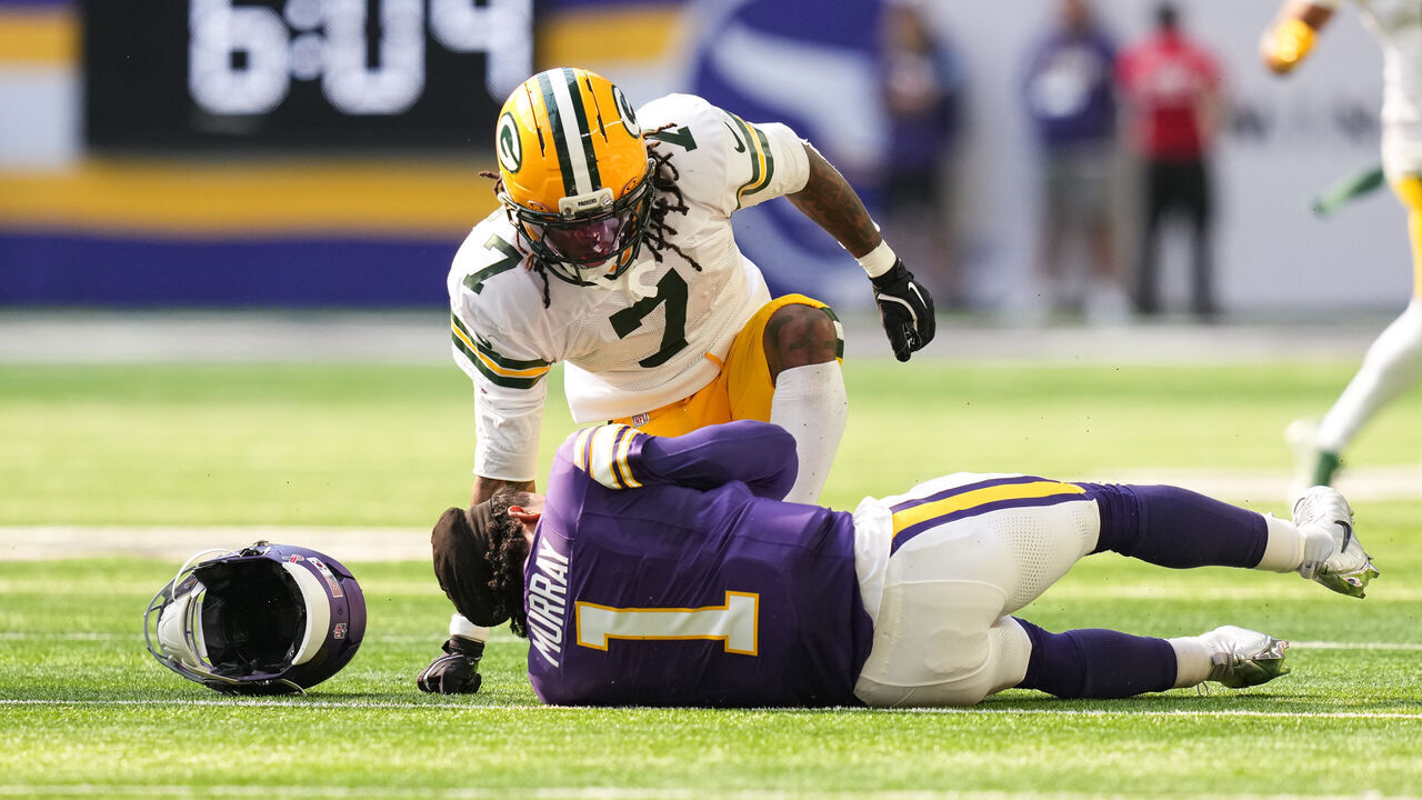MINNEAPOLIS, MINNESOTA - SEPTEMBER 13: Lukas Van Ness #90 and Javon Bullard #7 of the Green Bay Packers tackle Kyler Murray #1 of the Minnesota Vikings during the first quarter of the game on September 13, 2026 in Minneapolis, Minnesota.