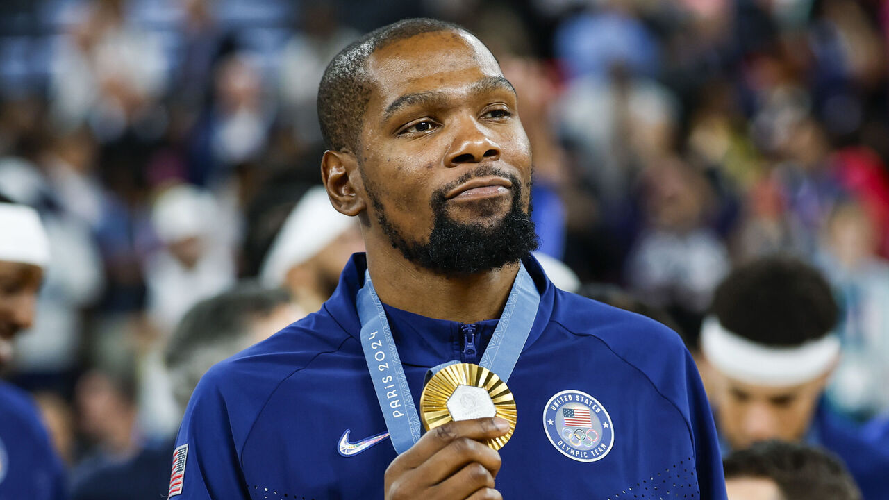 PARIS, FRANCE - AUGUST 11: Gold medalist Kevin Durant of United States celebrates during the Men's basketball medal ceremony after Men's Gold Medal between France and United States on Bercy Arena during the Paris 2024 Olympics Games on August 10, 2024 in Paris, France.