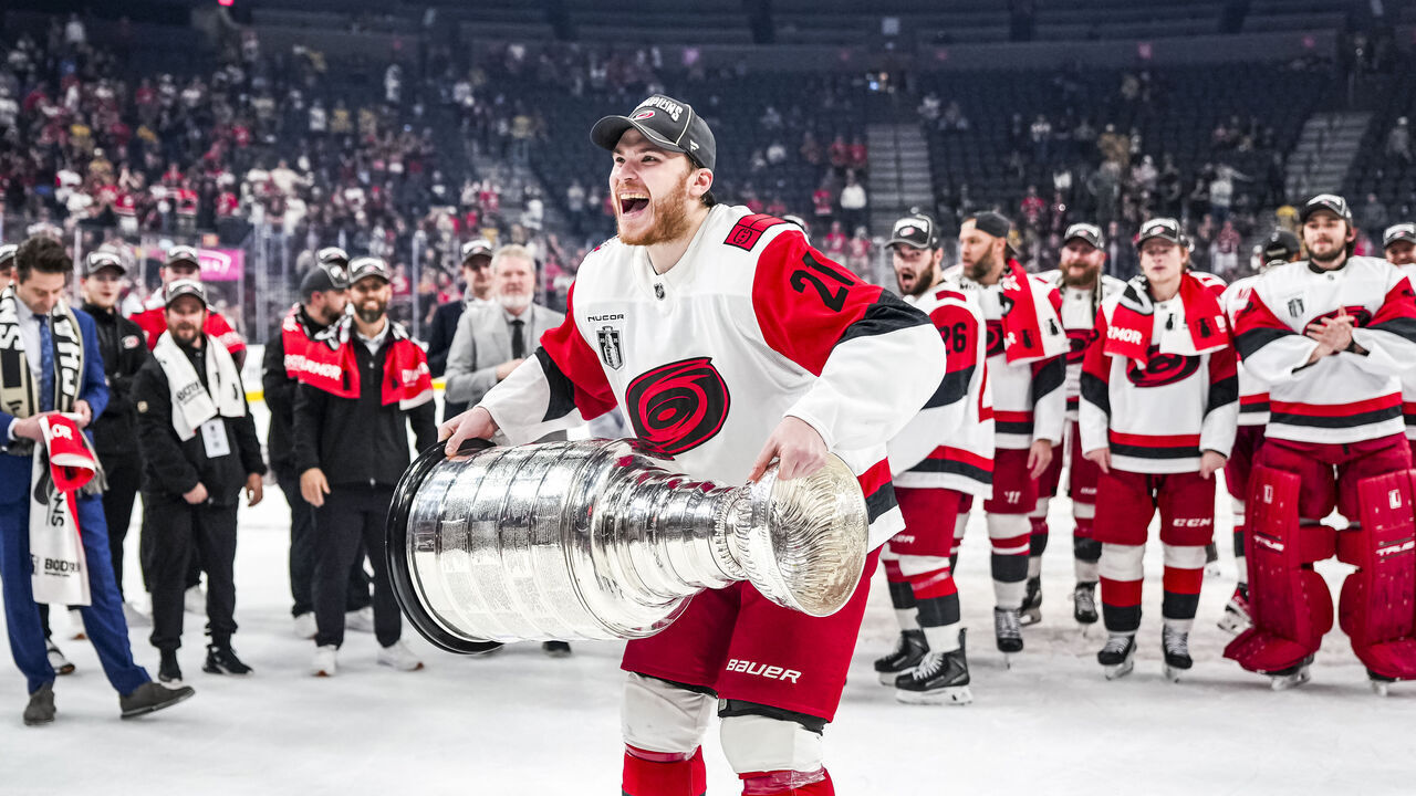 LAS VEGAS, NEVADA - JUNE 14: Alexander Nikishin #21 of the Carolina Hurricanes raises the Stanley Cup after winning the 2026 Stanley Cup Final at T-Mobile Arena on June 14, 2026 in Las Vegas, Nevada.
