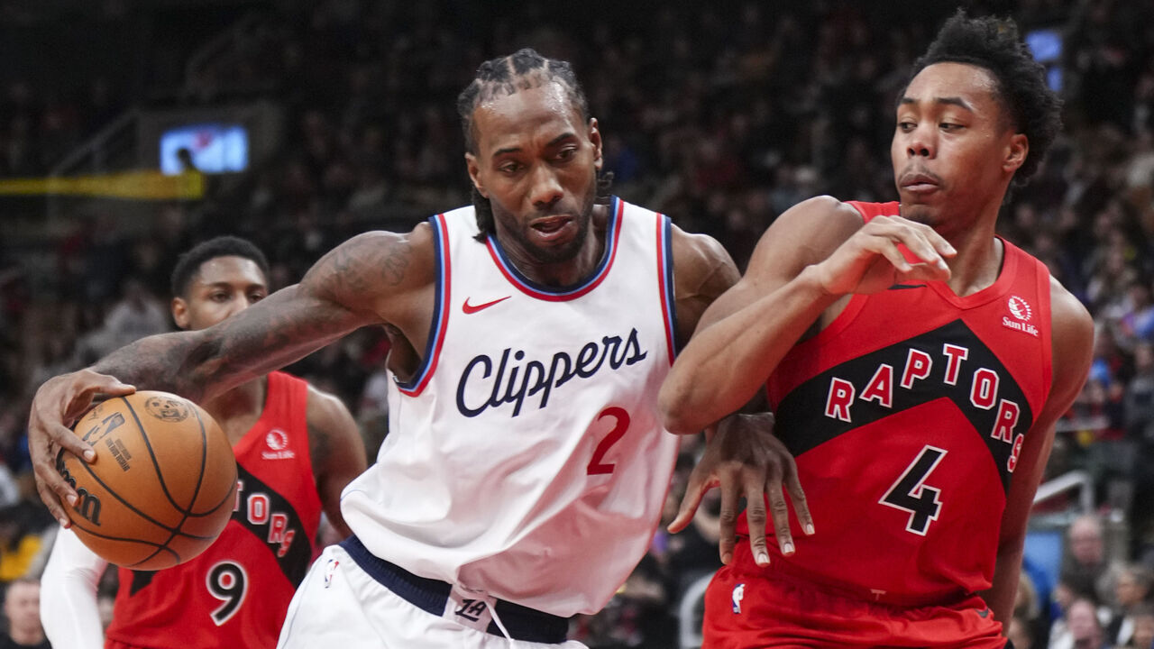 TORONTO, ON - FEBRUARY 2: Kawhi Leonard #2 of the Los Angeles Clippers is guarded by Scottie Barnes #4 of the Toronto Raptors during the second half of their basketball game at the Scotiabank Arena on February 2, 2025 in Toronto, Ontario, Canada. NOTE TO USER: User expressly acknowledges and agrees that, by downloading and/or using this Photograph, user is consenting to the terms and conditions of the Getty Images License Agreement.