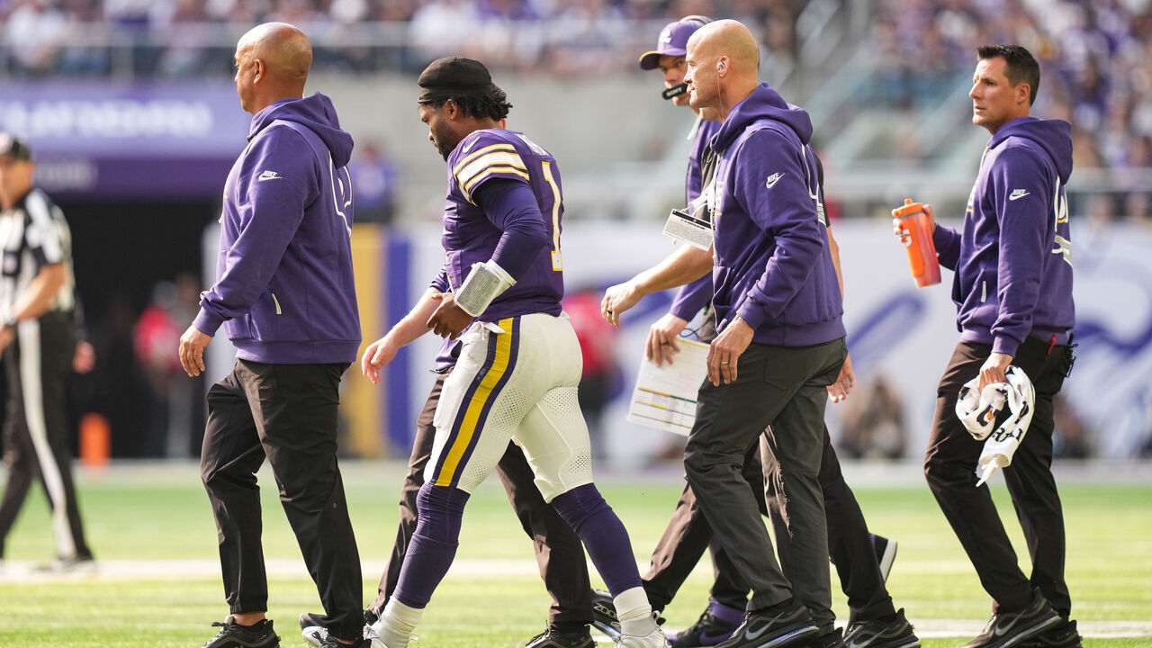 MINNEAPOLIS, MINNESOTA - SEPTEMBER 13: Team staff walk Kyler Murray #1 of the Minnesota Vikings off the field after a tackle during the first quarter of the game against the Green Bay Packers at U.S. Bank Stadium on September 13, 2026 in Minneapolis, Minnesota.