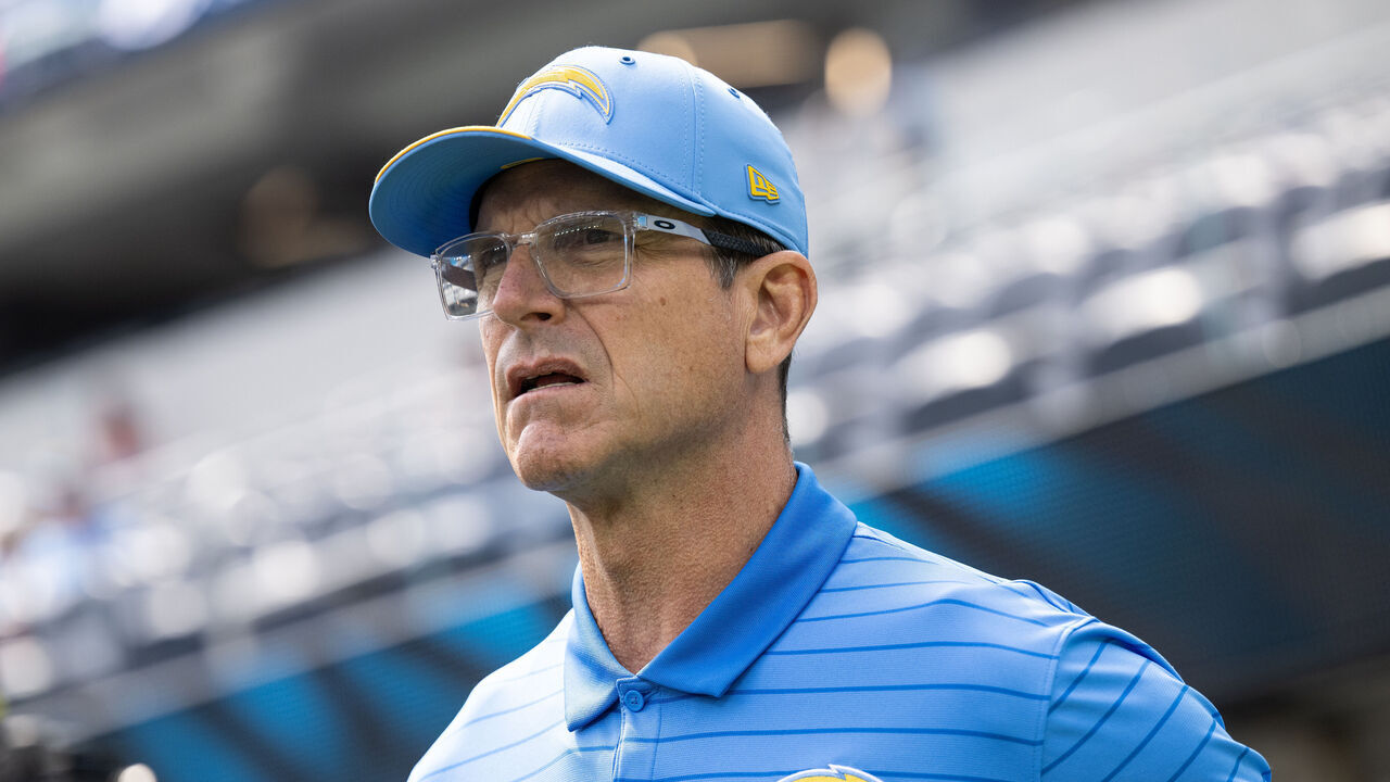 Inglewood, CA - The Los Angeles Chargers head coach Jim Harbaugh walks onto the field on Sunday, Sept. 13, 2026, before the season opener against the Arizona Cardinals at SoFi Stadium in Inglewood, CA. The Chargers host the Cardinals at home to open their season.