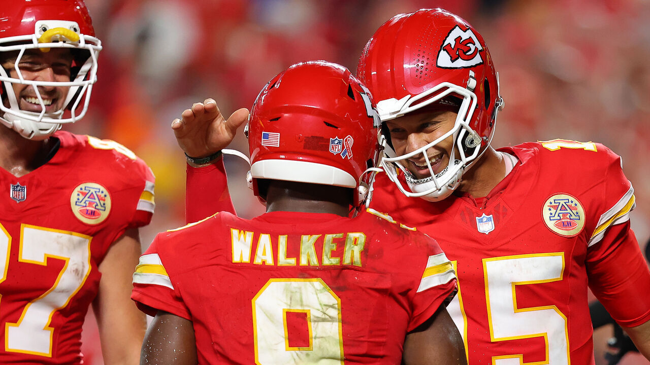 KANSAS CITY, MISSOURI - SEPTEMBER 14: Kenneth Walker III #9 of the Kansas City Chiefs celebrates with Patrick Mahomes #15 and Travis Kelce #87 after scoring a two yard touchdown against the Denver Broncos during the fourth quarter in the game at Arrowhead Stadium on September 14, 2026 in Kansas City, Missouri.