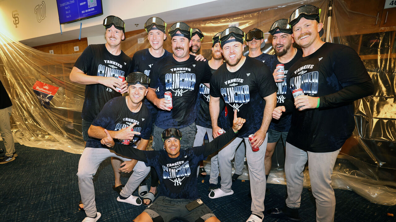 MINNEAPOLIS, MINNESOTA - SEPTEMBER 14: Members of the New York Yankees celebrate clinching a berth in the playoffs after defeating the Minnesota Twins 8-3 at Target Field on September 14, 2026 in Minneapolis, Minnesota.