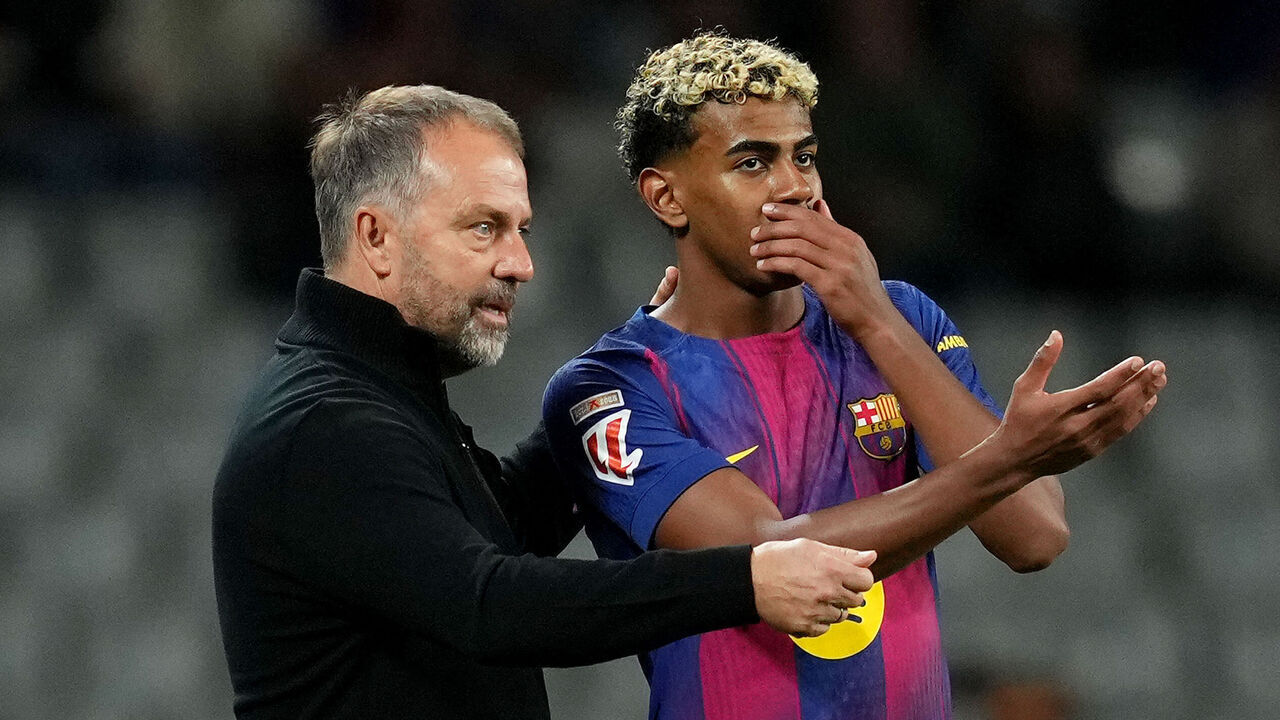 BARCELONA, SPAIN - NOVEMBER 02: Hansi Flick, Head Coach of FC Barcelona, speaks with Lamine Yamal of FC Barcelona during the LaLiga EA Sports match between FC Barcelona and Elche CF at Spotify Camp Nou on November 02, 2025 in Barcelona, Spain.