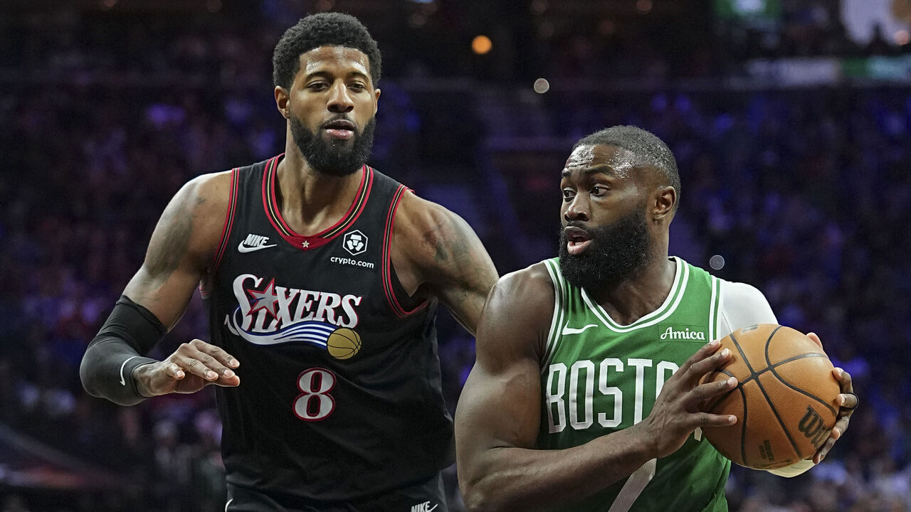 PHILADELPHIA, PENNSYLVANIA - APRIL 24: Jaylen Brown #7 of the Boston Celtics drives to the basket against Paul George #8 of the Philadelphia 76ers in the third quarter during game three of the Eastern Conference first round playoffs at Xfinity Mobile Arena on April 24, 2026 in Philadelphia, Pennsylvania. The Celtics defeated the 76ers 108-100.